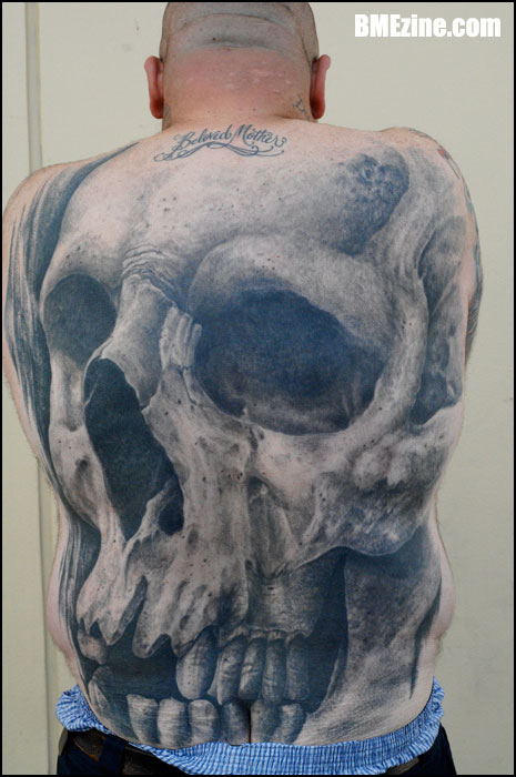 big skull tattoo at back body
